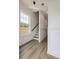 Bright entryway featuring hardwood floors, large windows and modern light fixtures with easy access to the stairway at 1906 Gumwood Blvd, North Charleston, SC 29406
