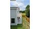 Aerial view of a home with a backyard, wooden fence, concrete patio, and second story deck at 1906 Gumwood Blvd, North Charleston, SC 29406