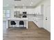 Bright kitchen with white cabinets, stainless steel appliances, and an island with bar stool seating at 1906 Gumwood Blvd, North Charleston, SC 29406