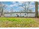 Large grassy backyard with mature trees offers a peaceful outdoor setting at 20 Stratton Dr, Charleston, SC 29420