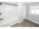 Bathroom with shower-tub combo featuring built-in shelves and modern hardware at 20 Stratton Dr, Charleston, SC 29420