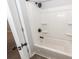 Bathroom with shower-tub combo featuring built-in shelves and modern hardware at 20 Stratton Dr, Charleston, SC 29420