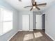 Bedroom featuring modern ceiling fan, closet, and window, enhancing comfort and natural light at 20 Stratton Dr, Charleston, SC 29420