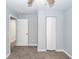 Bedroom with light gray walls, modern baseboards, updated flooring, and white closet doors at 20 Stratton Dr, Charleston, SC 29420