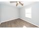 Bright bedroom featuring modern ceiling fan and window, enhancing comfort and natural light at 20 Stratton Dr, Charleston, SC 29420