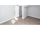 Bedroom featuring light gray walls, new baseboards, and updated floors at 20 Stratton Dr, Charleston, SC 29420