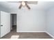 Bedroom featuring new flooring, light gray walls, modern baseboards, and ceiling fan at 20 Stratton Dr, Charleston, SC 29420