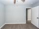 Bedroom featuring light gray walls, new baseboards, modern flooring, and a ceiling fan at 20 Stratton Dr, Charleston, SC 29420
