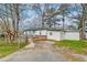 Exterior side view of home with siding, complemented by mature trees and a spacious lot at 20 Stratton Dr, Charleston, SC 29420