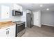 Modern kitchen features stainless steel appliances, light gray walls, wood countertops, and new flooring at 20 Stratton Dr, Charleston, SC 29420