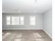 Bright living room featuring light gray walls, recessed lighting, and stylish, light-colored hardwood floors at 20 Stratton Dr, Charleston, SC 29420