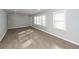 Bright living room featuring light gray walls, recessed lighting, and stylish, light-colored hardwood floors at 20 Stratton Dr, Charleston, SC 29420
