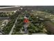 Aerial view highlighting the home's setting amidst trees, marsh, and waterways at 200 Wappoo Rd, Charleston, SC 29407