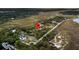 Aerial view showcasing a location near marshland, waterways, trees, and a neighborhood at 200 Wappoo Rd, Charleston, SC 29407
