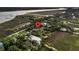 Aerial view showcases the property's location nestled among lush greenery near the water at 200 Wappoo Rd, Charleston, SC 29407