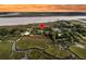 Aerial view showcases the home near marshland, a waterway, and a bridge at 200 Wappoo Rd, Charleston, SC 29407