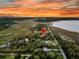 Aerial view showcases location with marshland, waterways, trees, and a suburban environment at 200 Wappoo Rd, Charleston, SC 29407