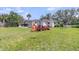 Spacious backyard featuring a Kubota tractor and well-maintained lawn at 200 Wappoo Rd, Charleston, SC 29407