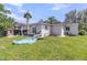 Backyard with outdoor seating, well-kept lawn, and a home exterior view at 200 Wappoo Rd, Charleston, SC 29407