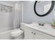 Bright bathroom featuring tiled walls, updated vanity, and shower/tub combo at 200 Wappoo Rd, Charleston, SC 29407