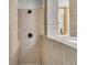 Updated bathroom with tiled walls, step in shower and soaking tub at 200 Wappoo Rd, Charleston, SC 29407