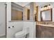 Updated bathroom featuring decorative backsplash, wood vanity, and modern toilet at 200 Wappoo Rd, Charleston, SC 29407