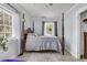 Bedroom featuring ceiling fan, large window, and four poster bed at 200 Wappoo Rd, Charleston, SC 29407