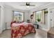 Cozy bedroom with neutral paint, ceiling fan, and windows with views to exterior at 200 Wappoo Rd, Charleston, SC 29407