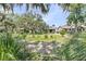 A house featuring a yard and shaded area covered by Spanish Moss at 200 Wappoo Rd, Charleston, SC 29407