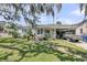 Charming home featuring a well-manicured front yard, carport, and inviting curb appeal at 200 Wappoo Rd, Charleston, SC 29407
