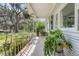 Charming front porch with potted plants and a cozy, inviting atmosphere at 200 Wappoo Rd, Charleston, SC 29407