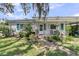 Beautiful home featuring a lovely front yard with meticulous landscaping at 200 Wappoo Rd, Charleston, SC 29407