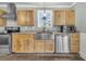 Well-appointed kitchen featuring stainless steel appliances and warm wooden cabinetry at 200 Wappoo Rd, Charleston, SC 29407