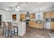 Modern kitchen with an island, stainless steel appliances, and natural wood cabinets at 200 Wappoo Rd, Charleston, SC 29407