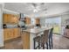 Charming kitchen with an island, granite countertops, stainless steel appliances, and natural wood cabinets at 200 Wappoo Rd, Charleston, SC 29407