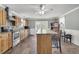 Well-lit kitchen with an island, stainless steel appliances, and access to an outdoor area at 200 Wappoo Rd, Charleston, SC 29407