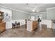 Bright eat-in kitchen with center island, stainless appliances, and exterior access at 200 Wappoo Rd, Charleston, SC 29407