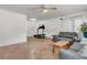 Bright living room features hardwood floors, a ceiling fan, and a comfortable seating area at 200 Wappoo Rd, Charleston, SC 29407