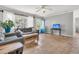 Inviting living room featuring hardwood floors, comfortable seating, and plenty of natural light at 200 Wappoo Rd, Charleston, SC 29407