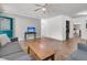Open living room with hardwood floors, neutral walls, and access to the kitchen at 200 Wappoo Rd, Charleston, SC 29407