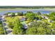 Aerial view of a beautiful home with a spacious yard, mature trees, and waterfront access at 2060 Wappoo Hall Rd, Charleston, SC 29412