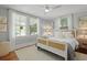 Inviting bedroom with a neutral color palette, ceiling fan, and natural light at 2060 Wappoo Hall Rd, Charleston, SC 29412