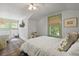 Bright bedroom with white wainscoting, wood floors, and a cozy sleeping area for children at 2060 Wappoo Hall Rd, Charleston, SC 29412