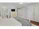 Comfortable bedroom with hardwood floors and an adjacent bathroom at 2060 Wappoo Hall Rd, Charleston, SC 29412