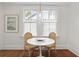 Charming breakfast nook with wicker seating, natural light, and hardwood floors at 2060 Wappoo Hall Rd, Charleston, SC 29412