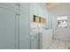 Well-organized laundry room with light blue cabinets and modern appliances at 2060 Wappoo Hall Rd, Charleston, SC 29412