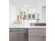 Bright kitchen with stainless steel appliances, a white countertop island, and hardwood floors at 21 George St # 206, Charleston, SC 29401