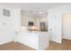 Well-lit kitchen boasts stainless appliances, white countertops, ample cabinet space, and hardwood flooring at 21 George St # 206, Charleston, SC 29401