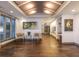Lobby with tiled floors, seating, paintings, and natural light from a window at 21 George St # 206, Charleston, SC 29401