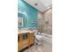 Modern bathroom featuring a blue accent wall, a glass-enclosed shower, and a vanity with storage at 2105 Loblolly Ln, Seabrook Island, SC 29455